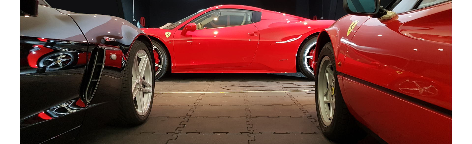 Virtuoso Detailing team working on a luxury car